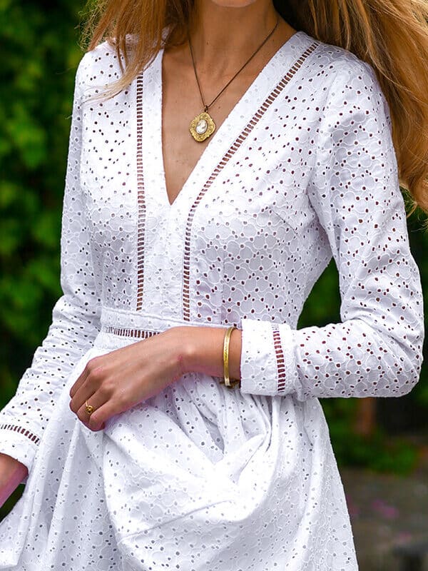 Close up on the lace ladder trim details: the trim is left unlined to show a flash of skin.